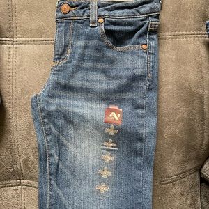 Brand new w/tags Arizona girls blue jeans, classic bootcut. Size 10 Reg.